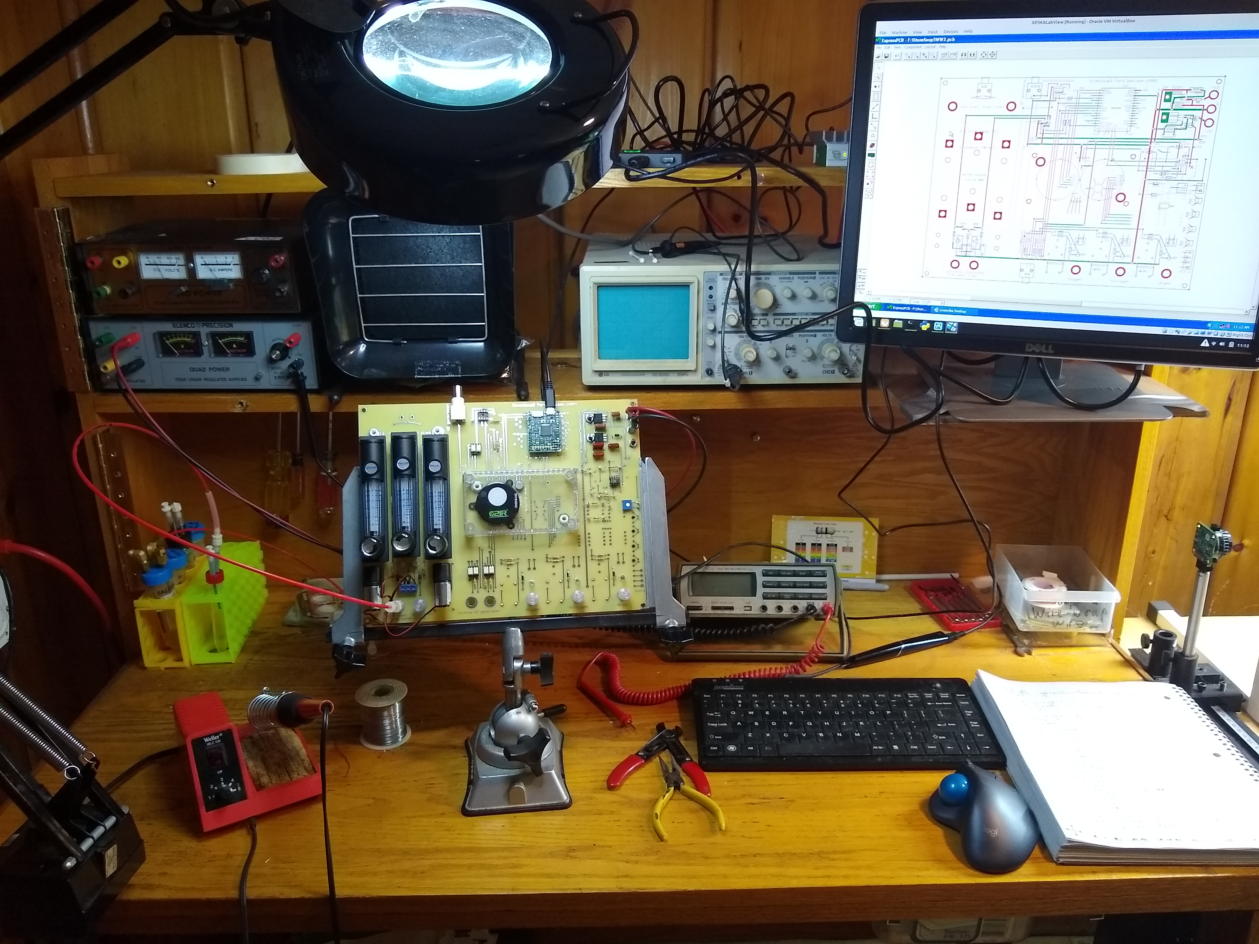 Electronics workbench with test equipment and circuit board